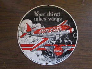 Coca-Cola Your thirst takes wings round metal sign