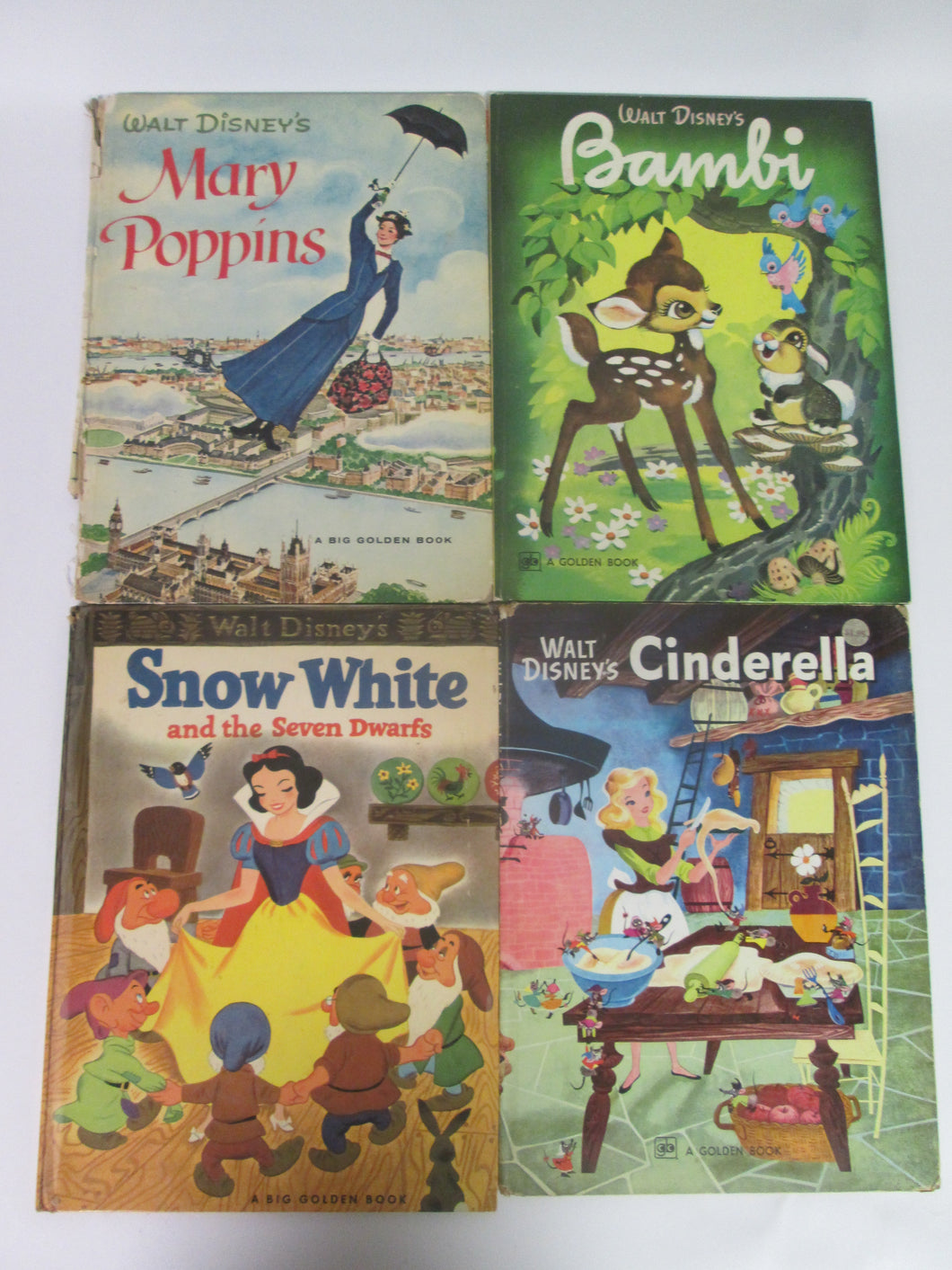 Disney Movie Books Set of 4 Big Golden Books: Snow White (1952),Cinderella(1978), Mary Poppins(1964) and Bambi (1974) HC