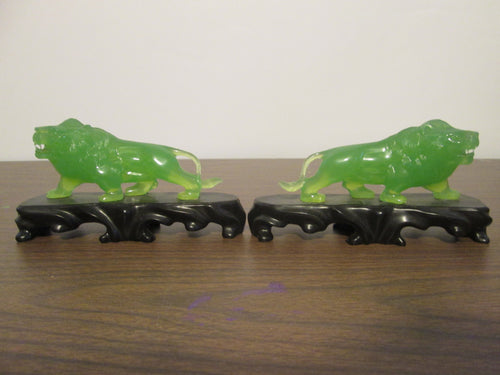 2 Plastic Jade Colored Lions on platforms made in Hong Kong