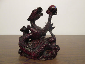 Red Resin Dragon Holding an Orb